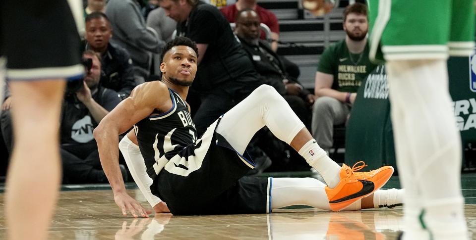 Milwaukee Bucks forward Giannis Antetokounmpo (34) sits on the court after an injury during the second half of their game against the Boston Celtics Tuesday, April 9, 2024 at Fiserv Forum in Milwaukee, Wisconsin.