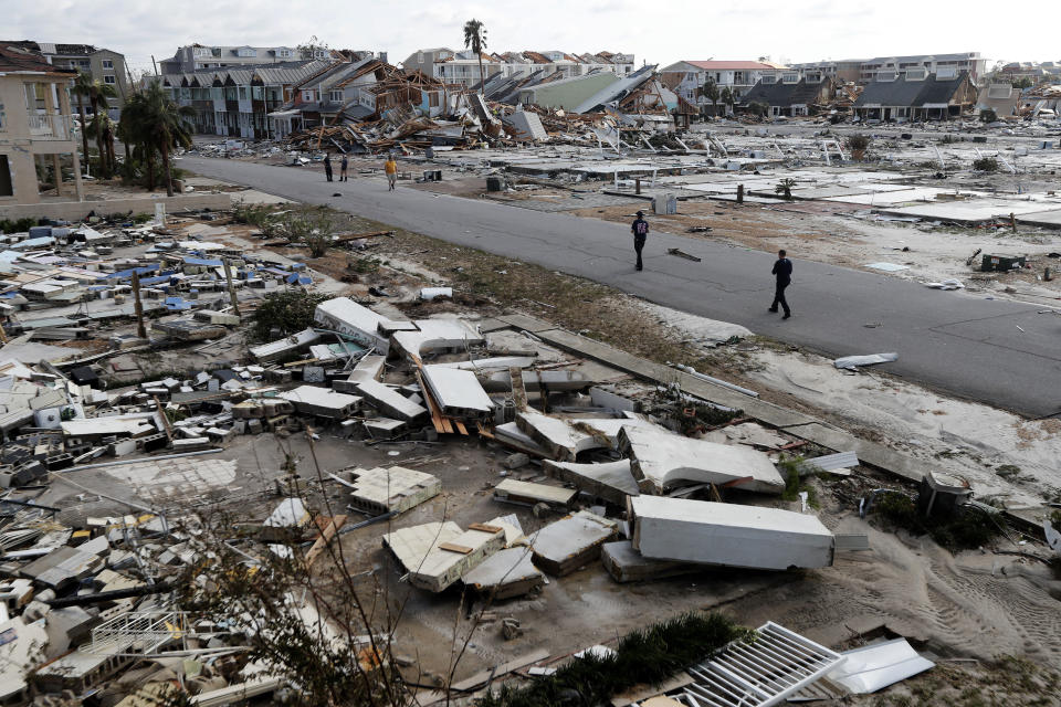 Rescue personnel search amidst debris in Mexico Beach.