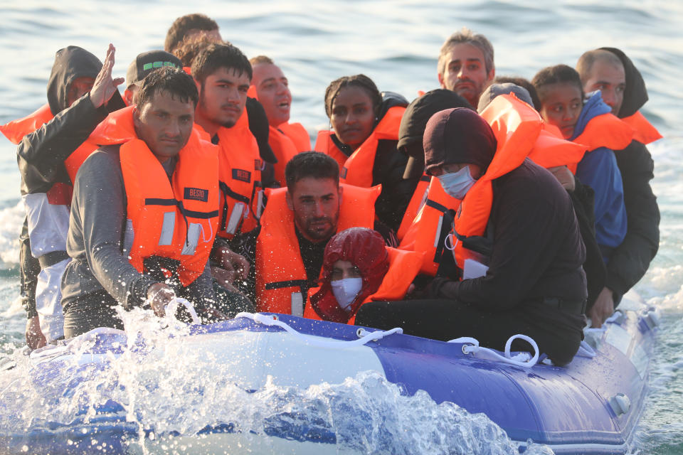 A group of people thought to be migrants crossing The Channel in a small boat headed in the direction of Dover, Kent. (Photo by Gareth Fuller/PA Images via Getty Images)