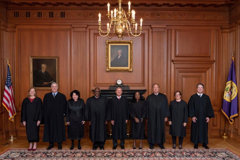 Members of the Supreme Court pose for a photo during Associate Justice Ketanji Brown Jackson's formal investiture ceremony at the Supreme Court in Washington on 30 September (AP)