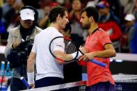 Tennis - China Open men's singles final - Beijing, China - 09/10/16. Britain's Andy Murray shakes hands with Bulgaria's Grigor Dimitrov after their match. REUTERS/Thomas Peter