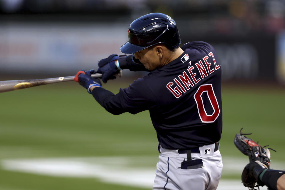 Cleveland Guardians' Andres Gimenez (0) hits a grand slam against the Oakland Athletics during the third inning of a baseball game in Oakland, Calif., Friday, April 29, 2022. (AP Photo/Jed Jacobsohn)