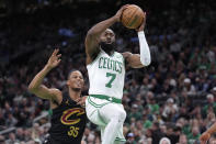 Boston Celtics guard Jaylen Brown (7) drives toward the basket as Cleveland Cavaliers forward Isaac Okoro (35) defends during the first half of Game 2 of an NBA basketball second-round playoff series Thursday, May 9, 2024, in Boston. (AP Photo/Steven Senne)