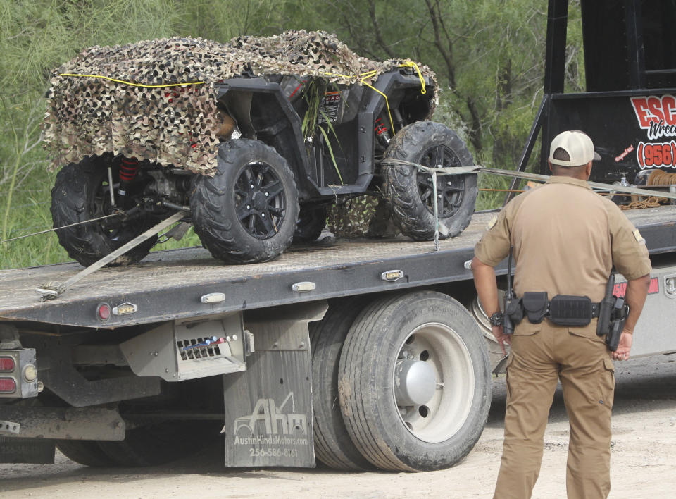 An ATV vehicle is removed from the scene where an off duty border patrol agent was killed on Wednesday Dec. 7, 2022 in Mission, Texas. (Delcia Lopez/The Monitor via AP)