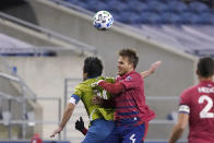 FC Dallas defender Bressan, right, and Seattle Sounders midfielder Nicolas Lodeiro vie for the ball during the second half of an MLS playoff soccer match Tuesday, Dec. 1, 2020, in Seattle. (AP Photo/Ted S. Warren)