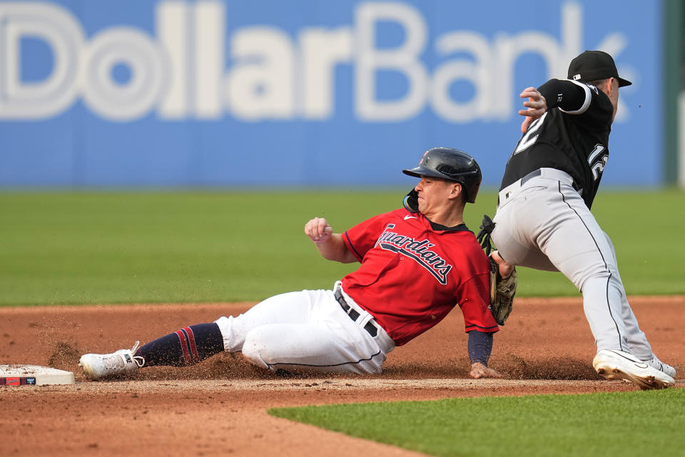 Cleveland Guardians' Will Brennan, left, is tagged out at second base by Chicago White Sox second baseman Romy Gonzalez, right, on an attempted steal in the second inning of a baseball game Monday, May 22, 2023, in Cleveland. (AP Photo/Sue Ogrocki)