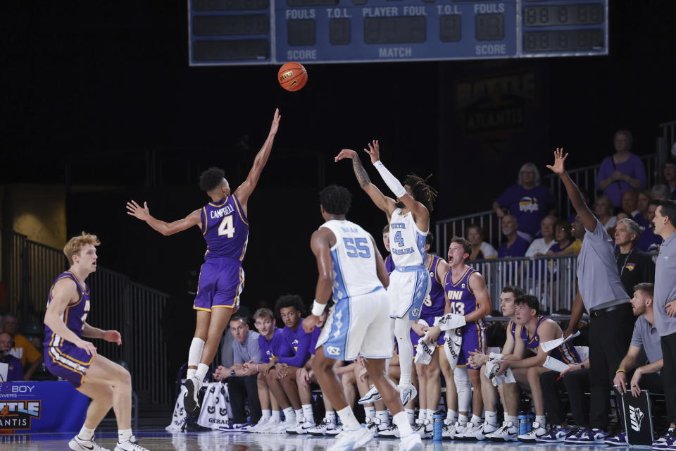 North Carolina's RJ Davis shoots over Northern Iowa's Trey Campbell during the first half of an NCAA college basketball game in the Battle 4 Atlantis at Paradise Island, Bahamas, Wednesday, Nov. 22, 2023. (Tim Aylen/Bahamas Visual Services via AP)