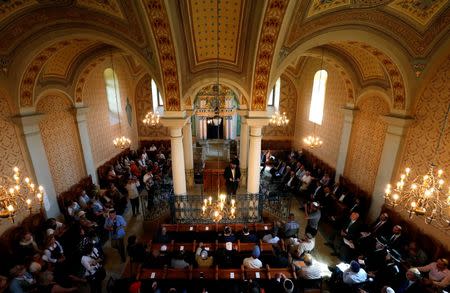 Jewish visitors pray in the synagogue in the village of Mad, Hungary, July 21, 2016. Picture taken July 21, 2016. REUTERS/Laszlo Balogh