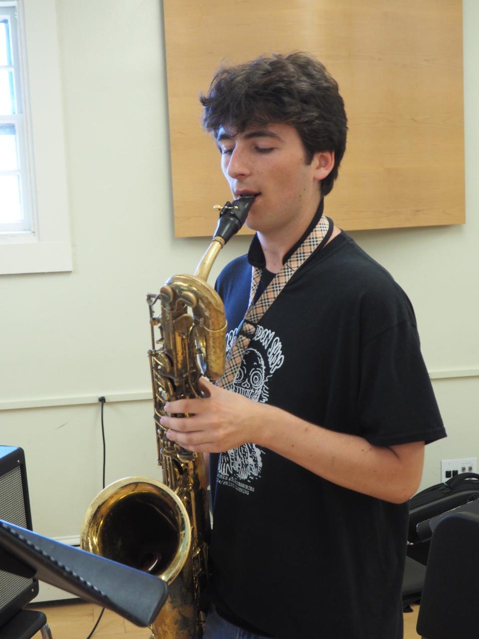 Ethan Hart of East Greenwich, Rhode Island plays his baritone saxophone at Newport Jazz Summer Camp.