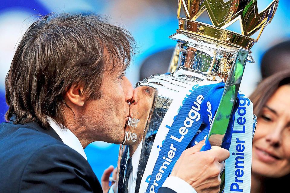 Sealed with a kiss | Conte gets his hands on the Premier League trophy, watched by his wife Elisabetta: Mike Egerton/PA Wire