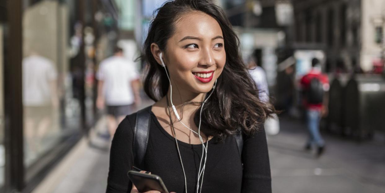 young woman listening to audiobook