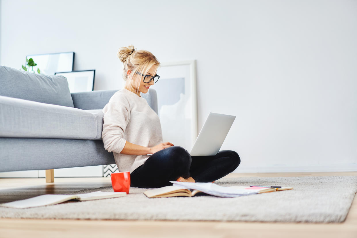 Working from the sofa might seem like a novelty, but it could be causing you some serious back issues. (Getty Images)