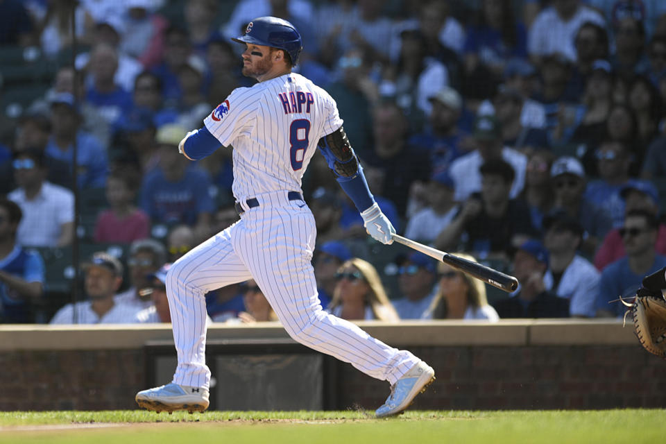 Chicago Cubs' Ian Happ watches his RBI double during the first inning of a baseball game against the Colorado Rockies, Saturday, Sept. 23, 2023, in Chicago. (AP Photo/Paul Beaty)