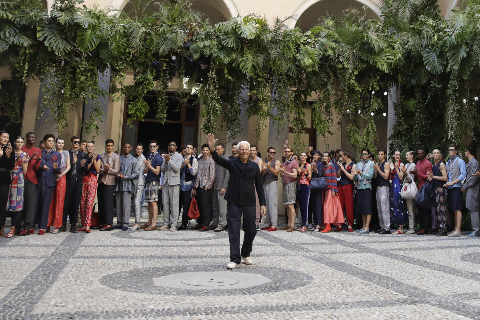 Designer Giorgio Armani accepts applause at the end of the Armani men's Spring-Summer 2020 collection, unveiled during the fashion week, in Milan, Italy, Monday, June 17, 2019. (AP Photo/Luca Bruno)