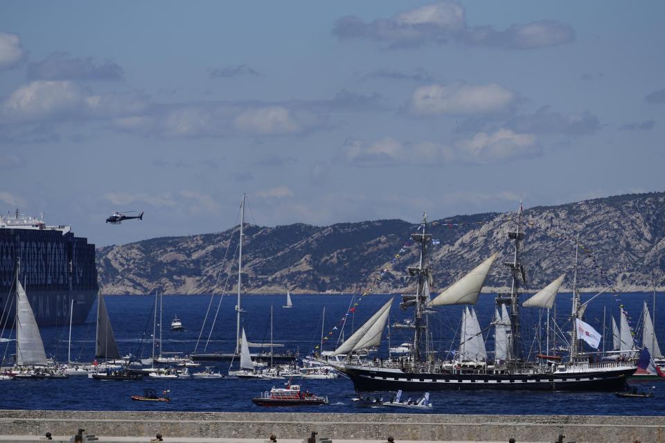 The Belem, the three-masted sailing ship which is carrying the Olympic flame, is accompanied by other boats approaching Marseille, southern France, Wednesday, May 8, 2024. After leaving Marseille, a vast relay route is undertaken before the torch odyssey ends on July 27 in Paris. The Paris 2024 Olympic Games will run from July 26 to Aug.11, 2024. (AP Photo/Thibault Camus)