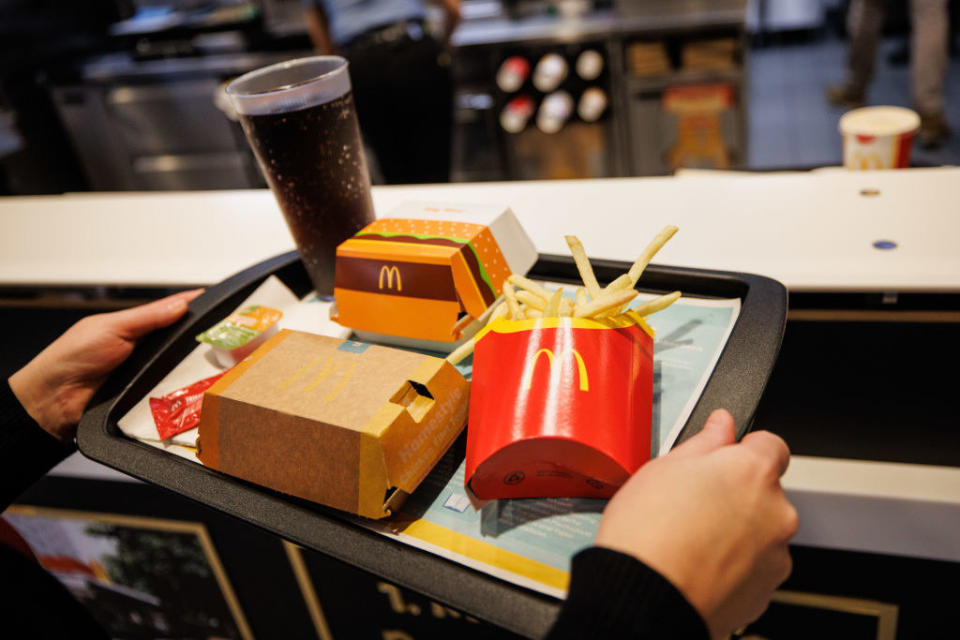 A customer carrying a McDonald's tray.