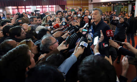 Argentina's President Mauricio Macri speaks to journalists after casting his vote in Buenos Aires, Argentina October 22, 2017. REUTERS/Marcos Brindicci