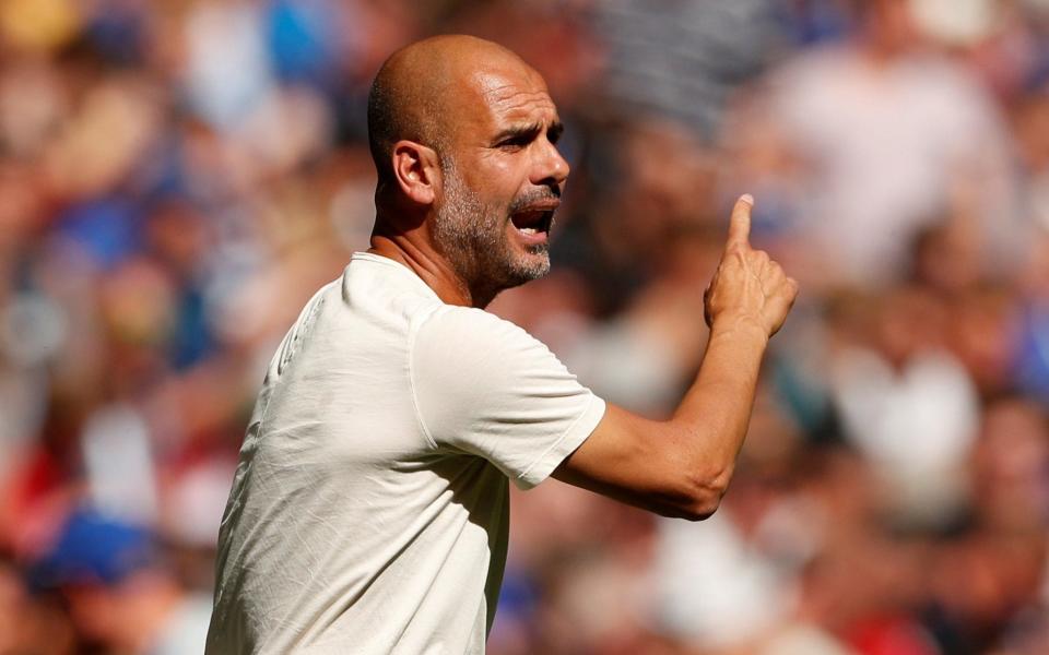 Guardiola's Man City are aiming to defend their Premier League title - REUTERS