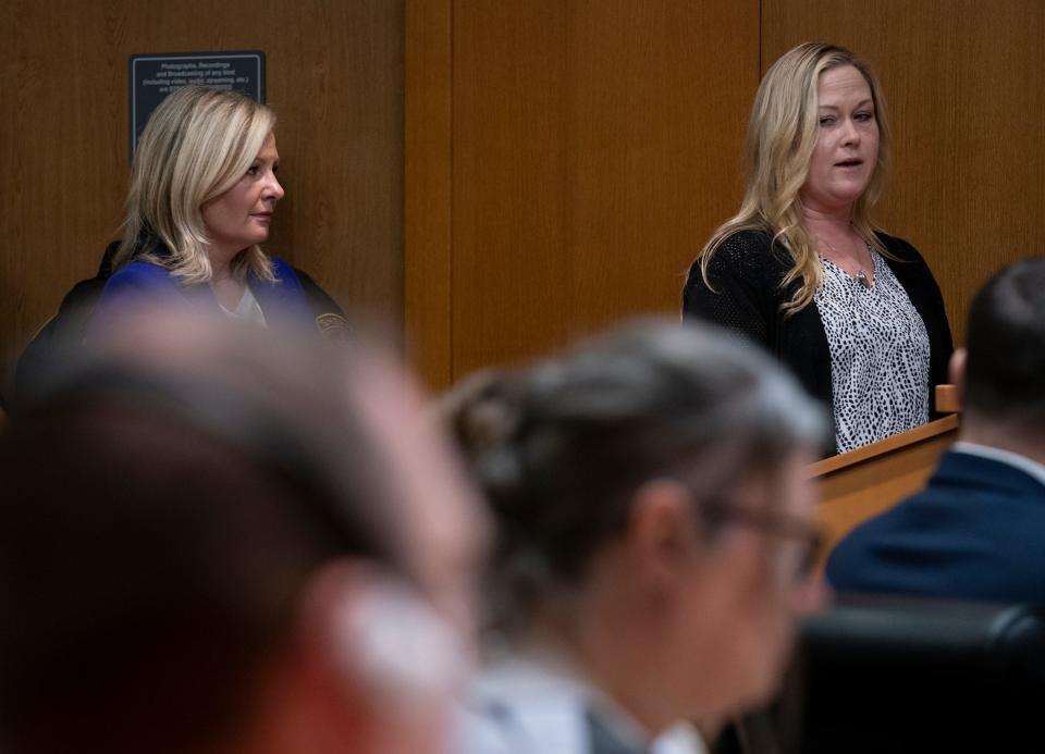 Oakland County Prosecutor Karen McDonald stands to the left as Jill Soave, mother of Justin Shilling who was killed in the 2021 Oxford School Shooting, makes a victim impact statement in the Oakland County courtroom of Judge Cheryl Matthews on Tuesday, April 9, 2024 before the sentencing of James and Jennifer Crumbley. The Crumbleys are the parents of the Oxford High School shooter and both were found guilty on four counts of involuntary manslaughter.