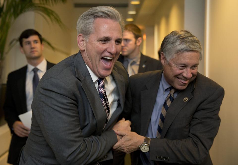 House Majority Leader Kevin McCarthy of Calif., left, and Rep. Fred Upton, R-Mich., laugh together as they walk from a meeting on Capitol Hill in Washington, on Oct. 26, 2015. Speaker John Boehner is pressing ahead with one last deal as he heads for the exits, pushing to finalize a far-reaching, two-year budget agreement with President Barack Obama before handing Congress' top job over to Rep. Paul Ryan this week, congressional officials said Monday.