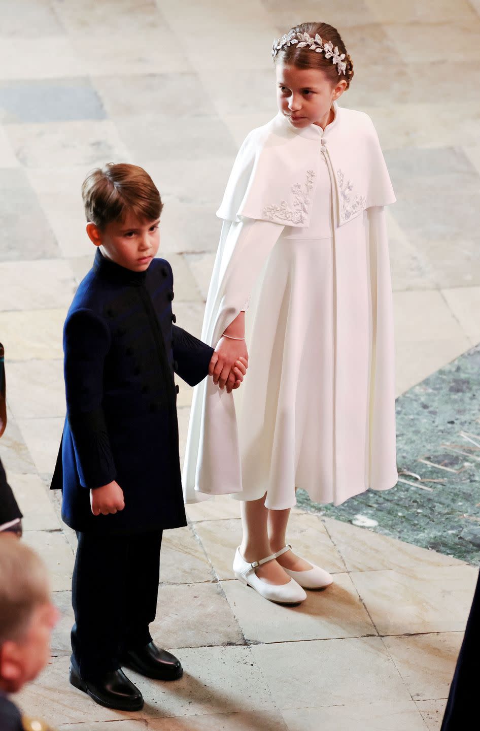 <p>The brother and sister are hand-in-hand heading into Westminster Abbey for their grandfather, King Charles' coronation.</p>