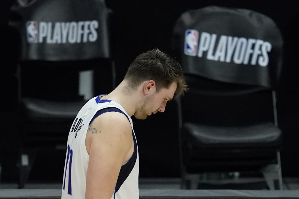 Dallas Mavericks guard Luka Doncic (77) leaves the court after Game 7 of an NBA basketball first-round playoff series against the Los Angeles Clippers Sunday, June 6, 2021, in Los Angeles, Calif. The Clippers won the game 126-111, and the series 4-3. (AP Photo/Ashley Landis)