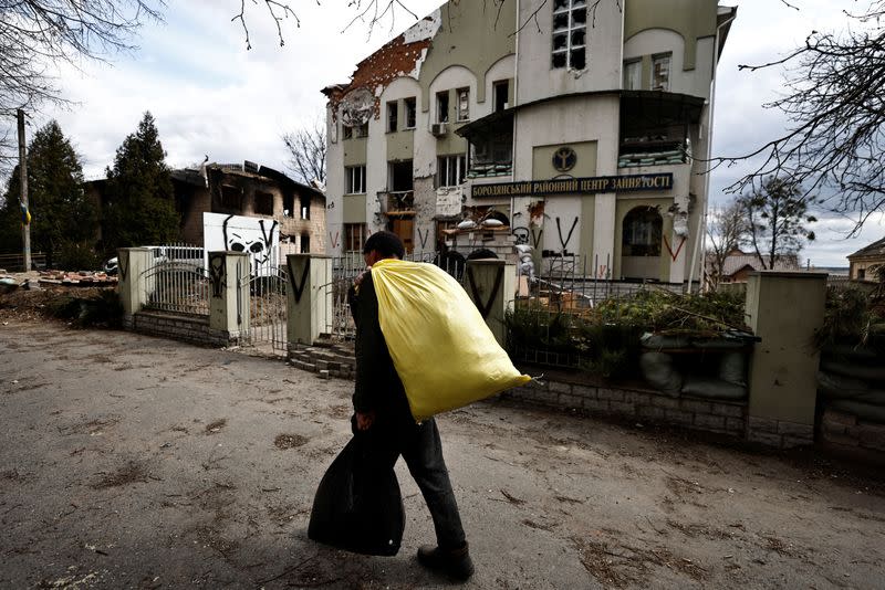 The Wider Image: Behind enemy lines, Ukrainian woman survives with her chickens