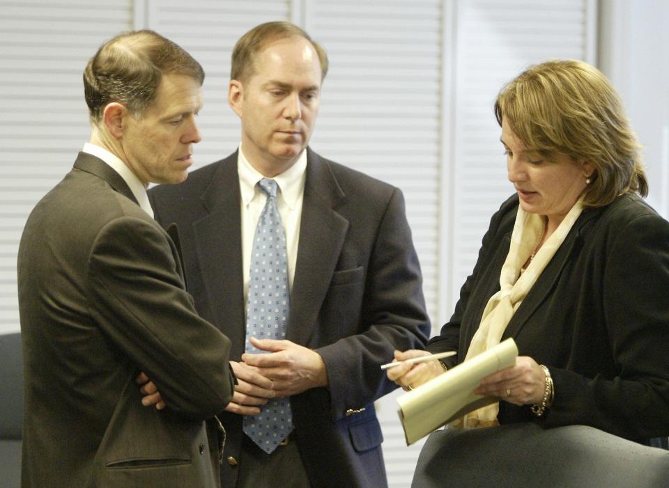 Jim Bourey, City Manager, (left to right), Knox White, Mayor, and Michelle Shain, City Councel Person, talk before executive session at City Hall to discuss a proposal for a new baseball stadium for the Greenville Braves, Wednesday, March 31, 2004. (Patrick Collard)