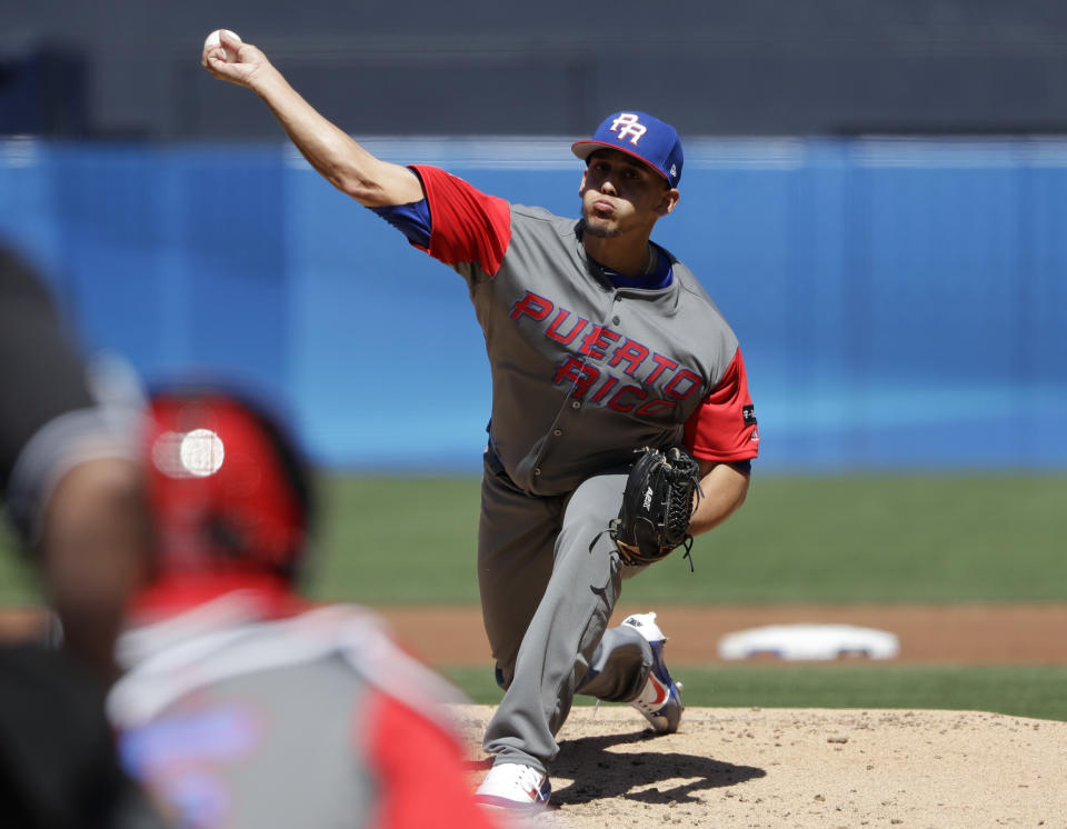 Puerto Rico pitcher Jose De Leon pitches to a Venezuela batter during the first inning of a second-round World Baseball Classic baseball game Saturday, March 18, 2017, in San Diego. (AP Photo/Gregory Bull)