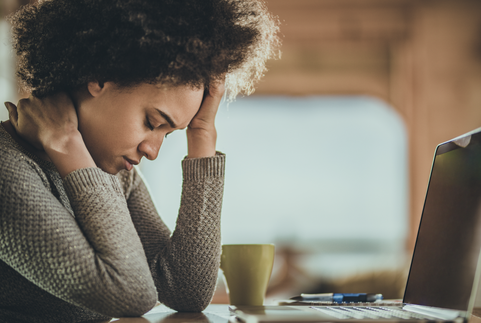 woman on her laptop struggling