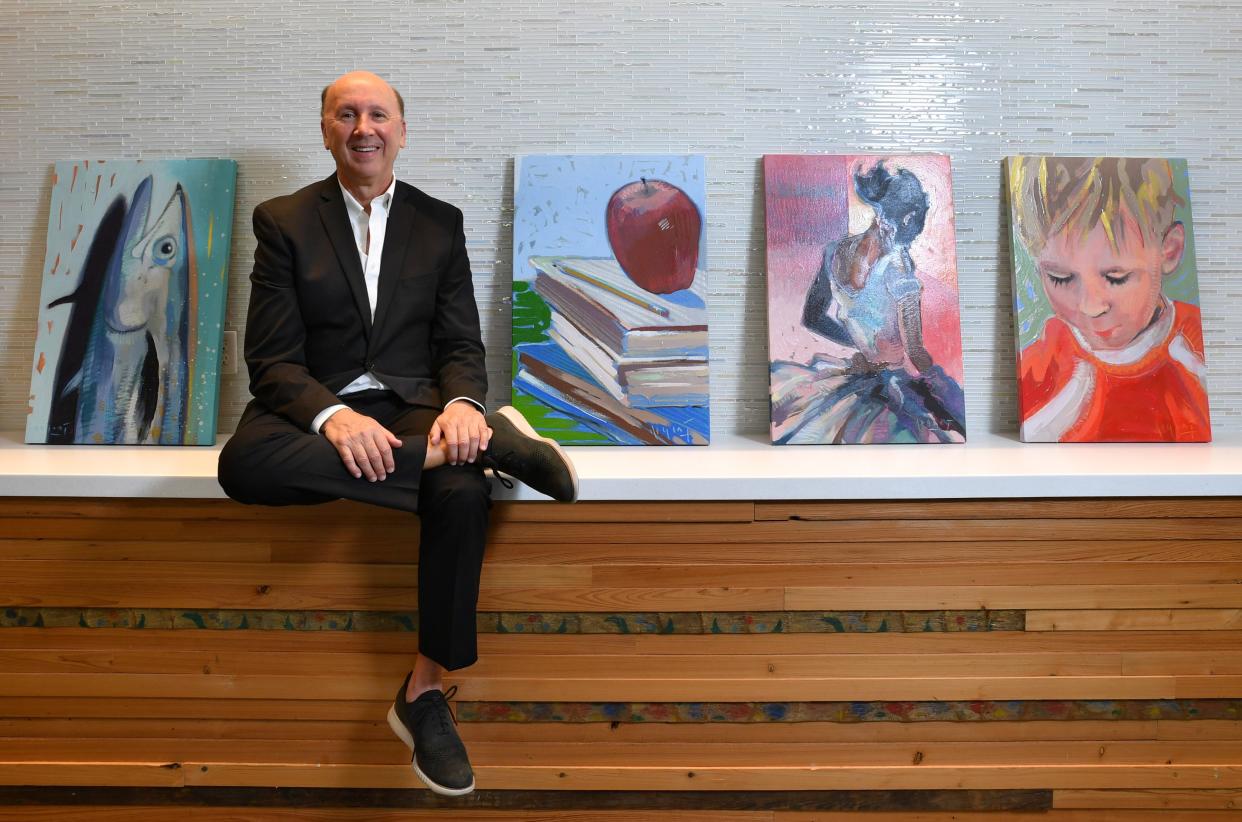 Mark Pritchett has announced his plans to retire as president and CEO of the Gulf Coast Community Foundation. Pritchett is only the third person to run the foundation, which was started with seed money from the sale of Venice Hospital.  Pritchett sits next to four paintings commissioned to represent the foundations core areas of concern: from left, the environment, education, the arts and health & human services. 