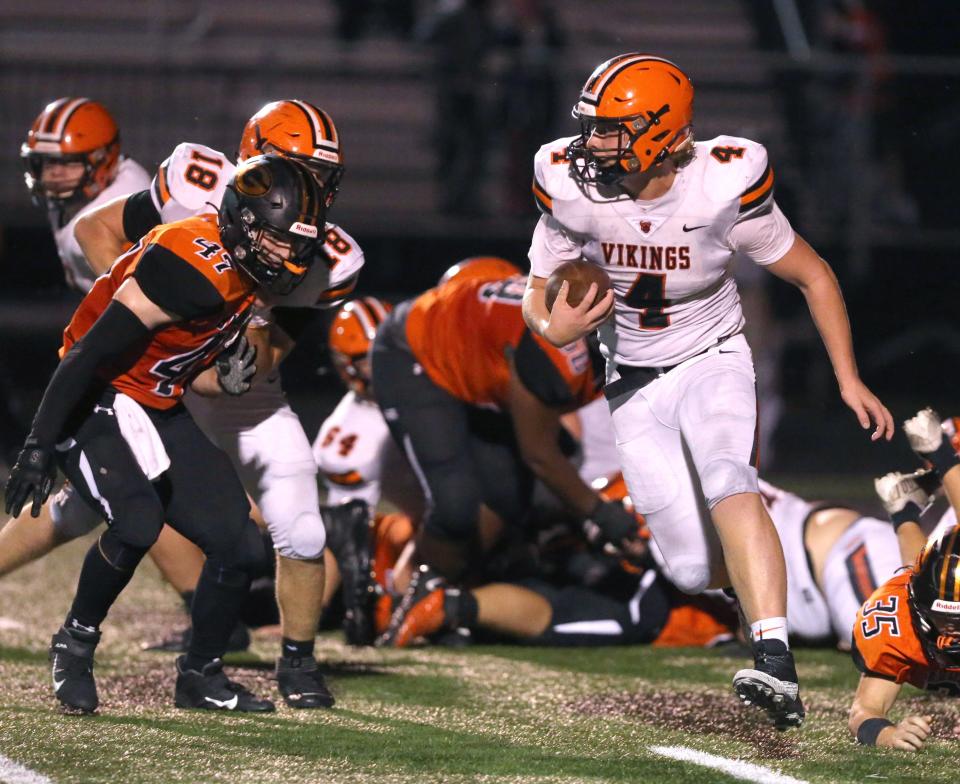 Drew Logan, 4, of Hoover tries to run past Vincent Galvin, 47, of Green during their game at Green on Friday, Oct. 15, 2021.