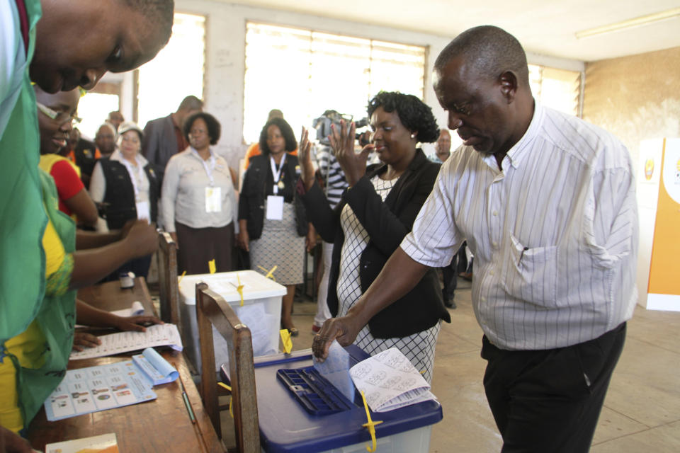 Voters queue to cast their votes in Maputo, Mozambique, Tuesday, Oct. 15, 2019 in the country's presidential, parliamentary and provincial elections. Polling stations opened across the country with 13 million voters registered to cast ballots in elections seen as key to consolidating peace in the southern African nation. (AP Photo/Ferhat Momade)