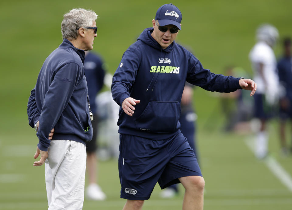 The Seattle Seahawks reportedly fired offensive coordinator Darrell Bevell, right. He had been with the team since 2011. (AP)