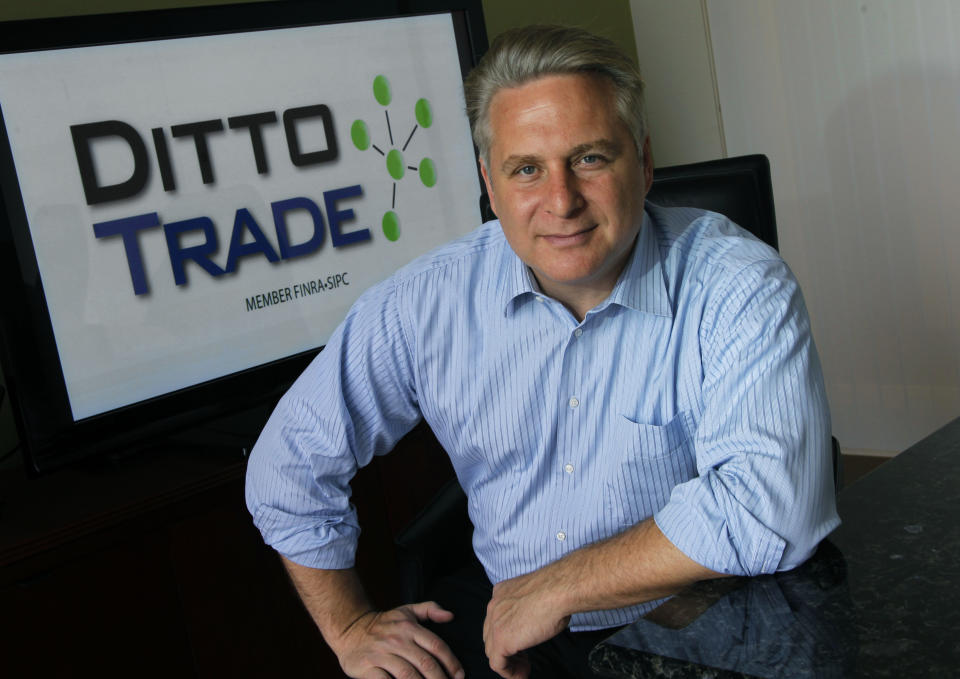 In this Sept. 12, 2012, photo, Joe Fox, CEO of Ditto Trade, poses in his offices in Los Angeles. Ditto Trade is a new online brokerage firm where one can attach their stock portfolio to that of person they trust, so that when they make a trade, so will you. (AP Photo/Reed Saxon)