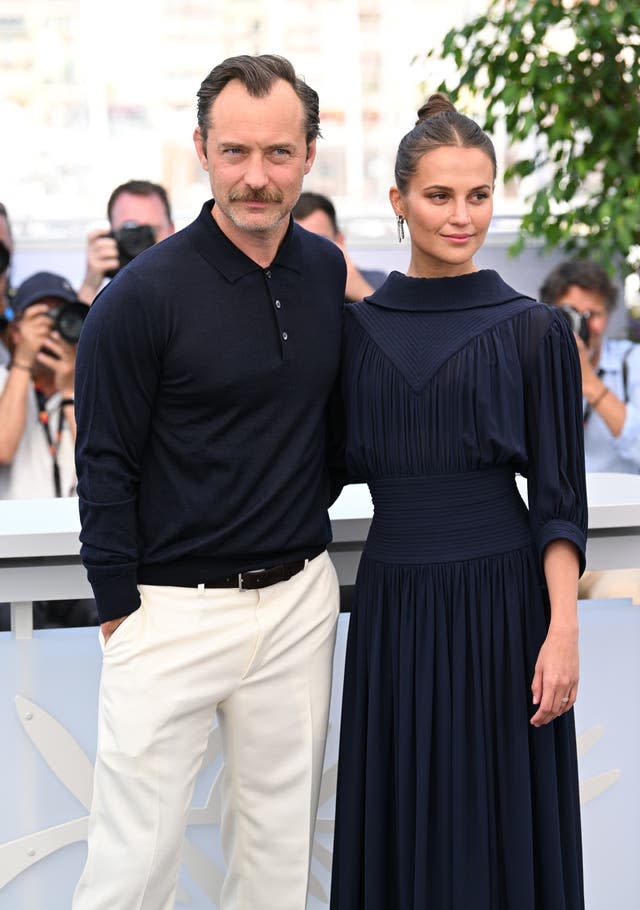 Jude Law and Alicia Vikander attending the photocall for the film Firebrand, during the 76th Cannes Film Festival