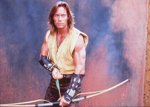 kevin sorbo as hercules, bow and arrow, sexy arms.