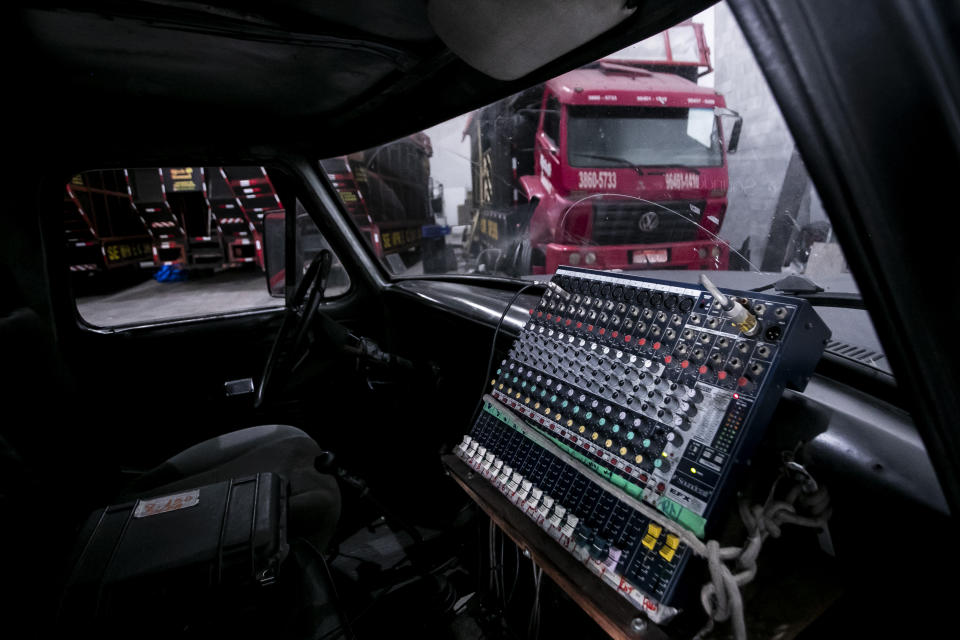 A mixing console is attached to a dashboard of an electric trio sound truck, inside the Rick Sound warehouse, in Rio de Janeiro, Brazil, Tuesday, Jan. 30, 2024. Since 1987, the company has adapted trucks to provide sound for Carnival street block parties and to samba schools rehearsing for the Sambadrome parade. (AP Photo/Bruna Prado)