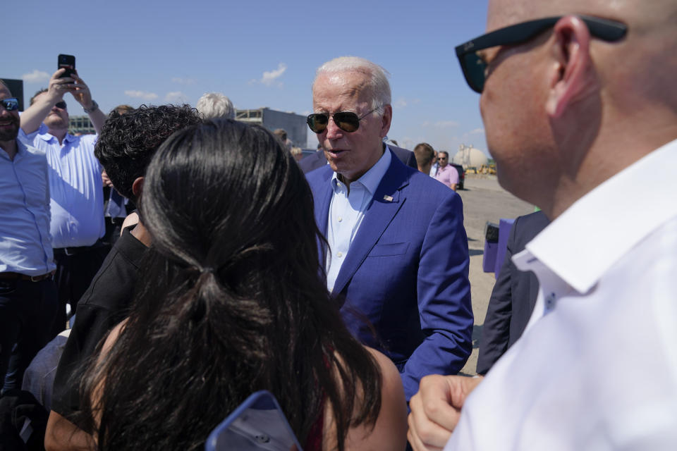 President Joe Biden greets people after speaking about climate change and clean energy at Brayton Power Station, Wednesday, July 20, 2022, in Somerset, Mass. (AP Photo/Evan Vucci)