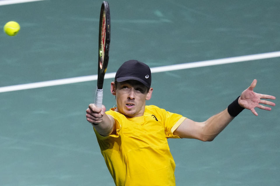 Australia's Alex De Minaur plays a shot against Jiri Lehecka of the Czech Republic during a Davis Cup quarter-final tennis match between Australia and Czech Republic in Malaga, Spain, Wednesday, Nov. 22, 2023. (AP Photo/Manu Fernandez)