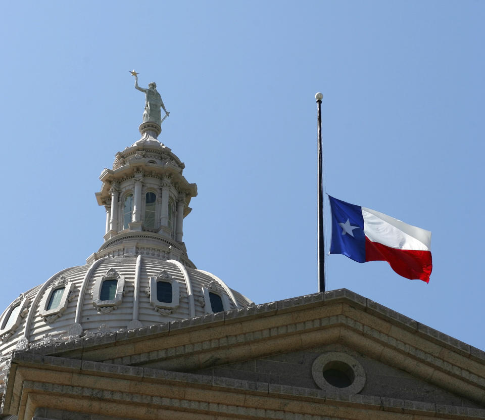 FILE - The Texas flag flies at half-staff on the Capitol, Sept. 14, 2006, in Austin, Texas. A Texas judge presiding over Republicans' widespread challenges to losses in the 2022 elections around Houston said Thursday, Aug. 10, 2023 he will likely not issue a decision for weeks in a trial that offered no evidence that paper ballot shortages last November affected the outcome. (AP Photo/Harry Cabluck, file)