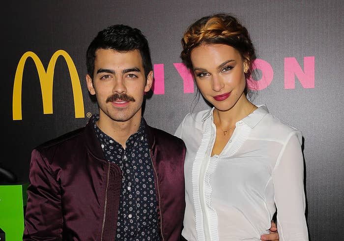 Joe with his arm around Blanda's waist