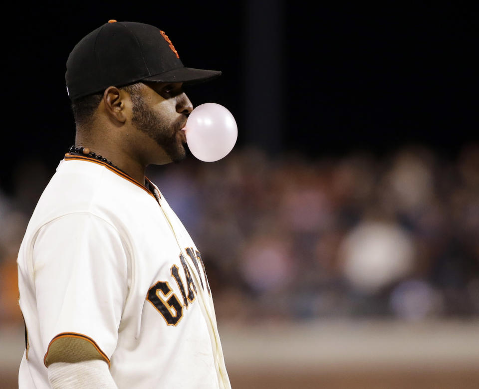 San Francisco Giants' Pablo Sandoval blows bubble gum during the fifth inning of a baseball game against the San Diego Padres on Monday, April 28, 2014, in San Francisco. (AP Photo/Marcio Jose Sanchez)