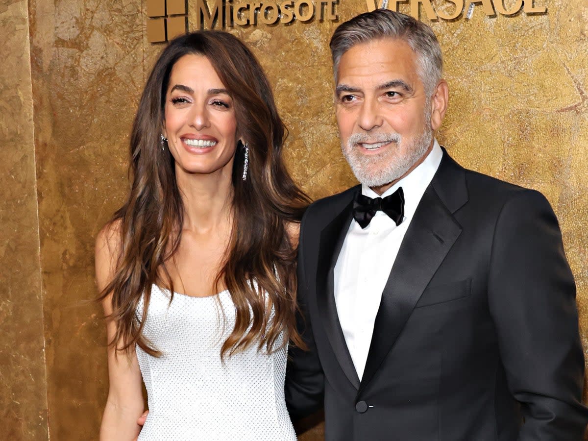 George Clooney, who has been open about his health woes, with his wife Amal (Getty Images)