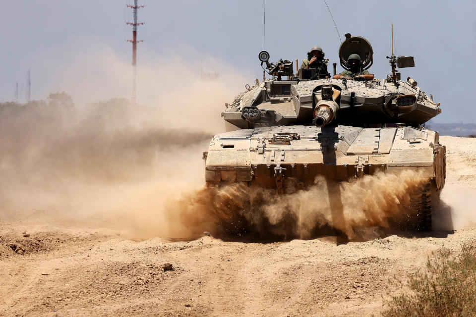 An Israeli army tank rolls to take position in an area along Israel's southern border with the Palestinian Gaza Strip on June 18, 2024. (Jack Guez / AFP - Getty Images)