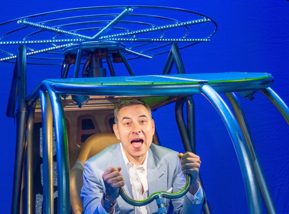 <p>David Walliams sits in a model helicopter onstage at the Garrick Theatre in London, during a visit to meet the cast of Billionaire Boy, the West End production of his best selling children's book, which opens on July 17th. Picture date: Friday July 16, 2021.</p>
