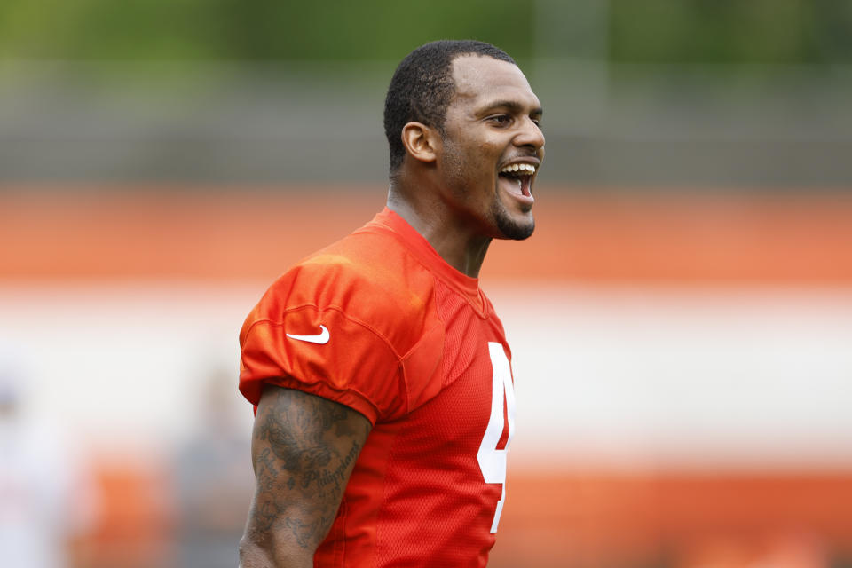 Cleveland Browns quarterback Deshaun Watson celebrates after a play during an NFL football practice at the team's training facility Wednesday, May 25, 2022, in Berea, Ohio. (AP Photo/Ron Schwane)