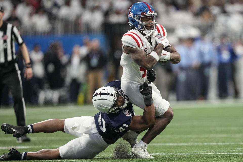 Penn State linebacker Kobe King (41) tackles Mississippi running back Quinshon Judkins (4) during the first half of the Peach Bowl NCAA college football game, Saturday, Dec. 30, 2023, in Atlanta. (AP Photo/Brynn Anderson)