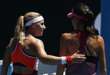 Tennis - Australian Open - Melbourne Park, Melbourne, Australia - 19/1/17 Slovakia's Dominika Cibulkova consoles Taiwan's Hsieh Su-Wei after winning their Women's singles second round match. REUTERS/Issei Kato