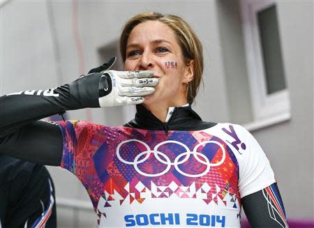 Noelle Pikus-Pace of the U.S. reacts after competing in the women's skeleton event at the 2014 Sochi Winter Olympics, at the Sanki Sliding Center in Rosa Khutor February 14, 2014. REUTERS/Arnd Wiegmann \